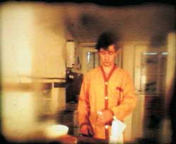  Adagp Pierrick Sorin - L'homme qui aimait les biscottes 1988 Film super 8 transfr  - Collection du Frac Pays de la Loire